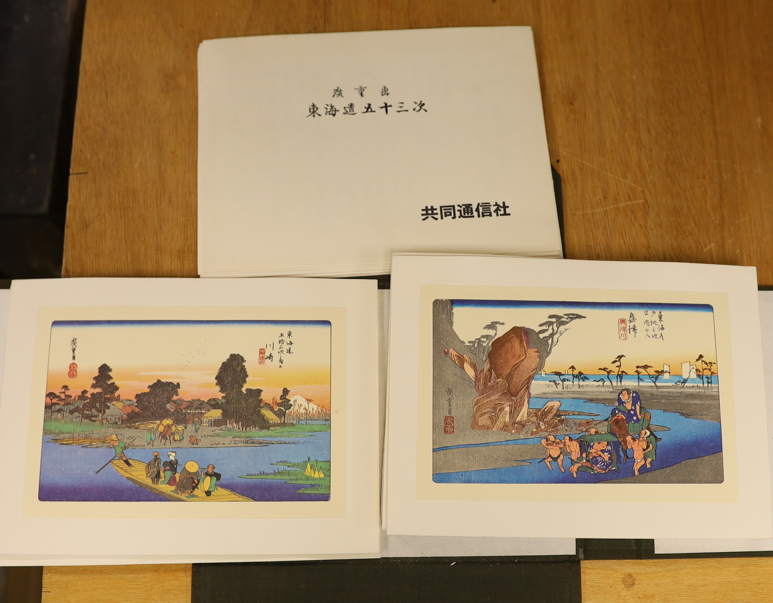 A group of reproduction Japanese woodblock prints, generally 16 x 24cm, in folder